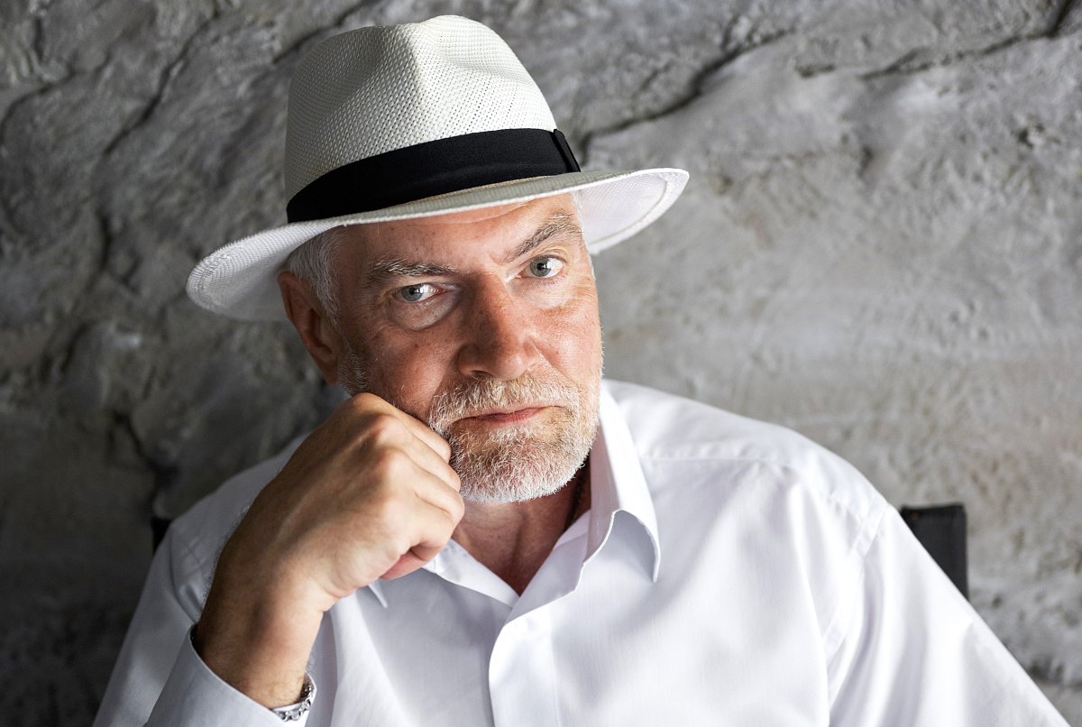 senior-man-posing-white-shirt-hat-1--1.jpg